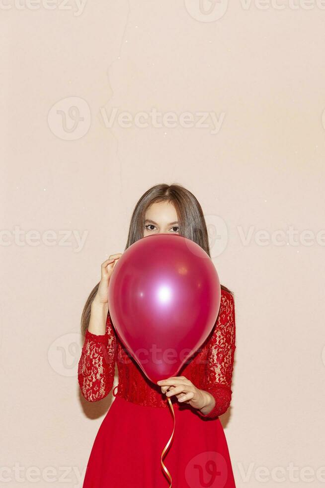 young  and beautiful woman holds air balloons. valentines day, birthday, womens day, anniversary, holiday celebration concept photo