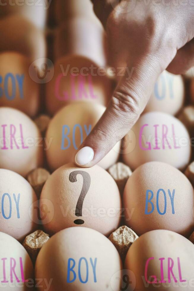 Hand points to egg. Gender or Sex selection photo