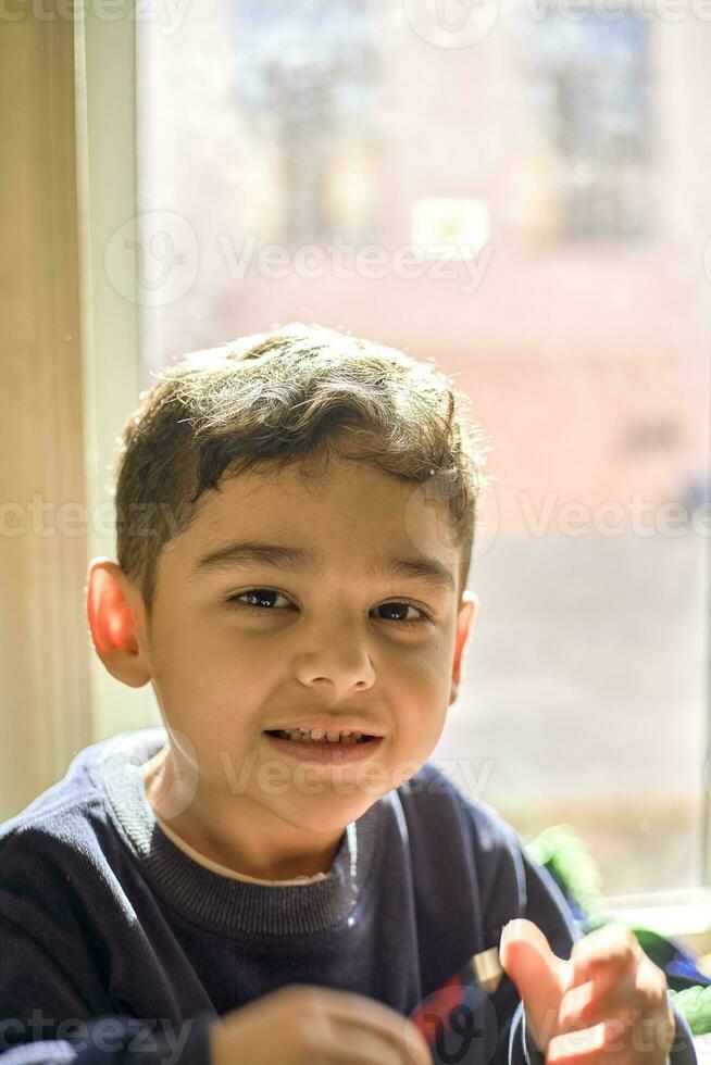 Portrait of cheerful middle-eastern boy photo