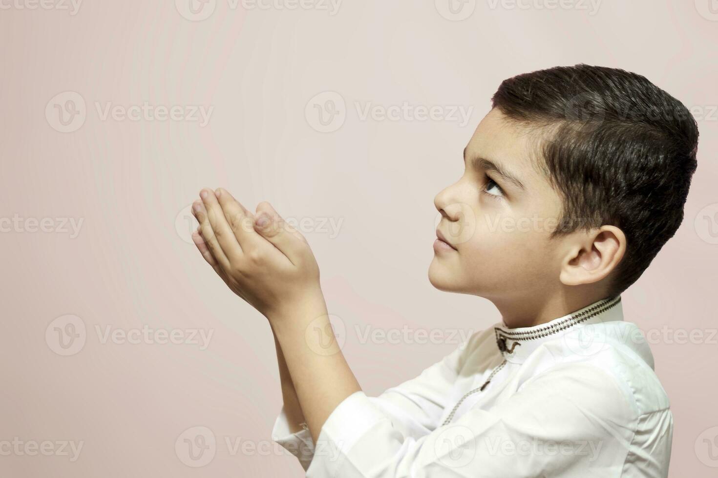 Praying muslim boy photo