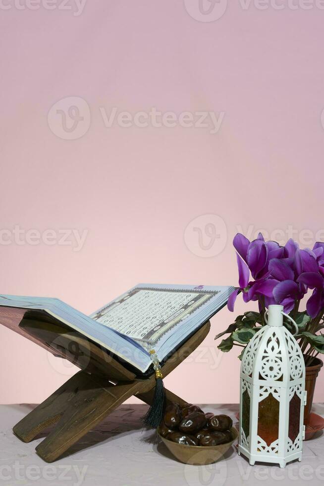 Ramadan background. Rehal with open Quran. Quran open in wooden placemat photo