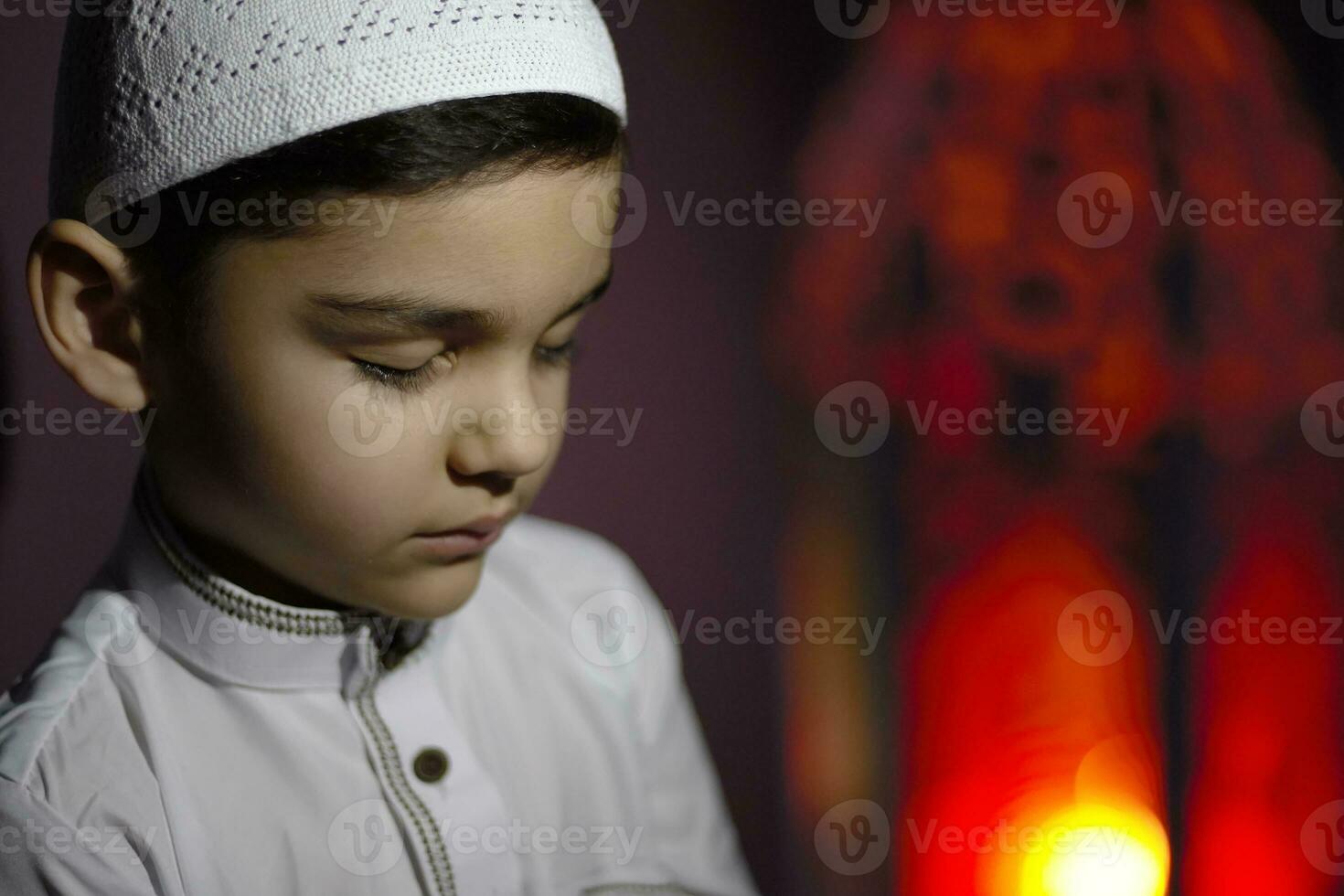 Praying muslim boy photo