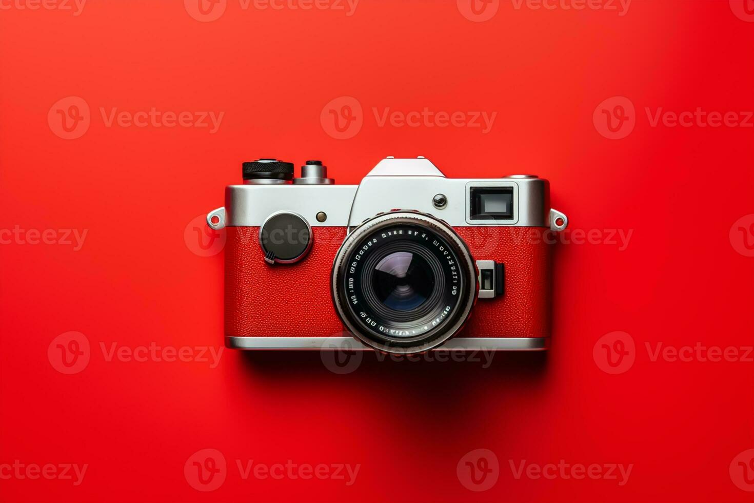 Retro camera isolated on red background. Flat lay, top view photo