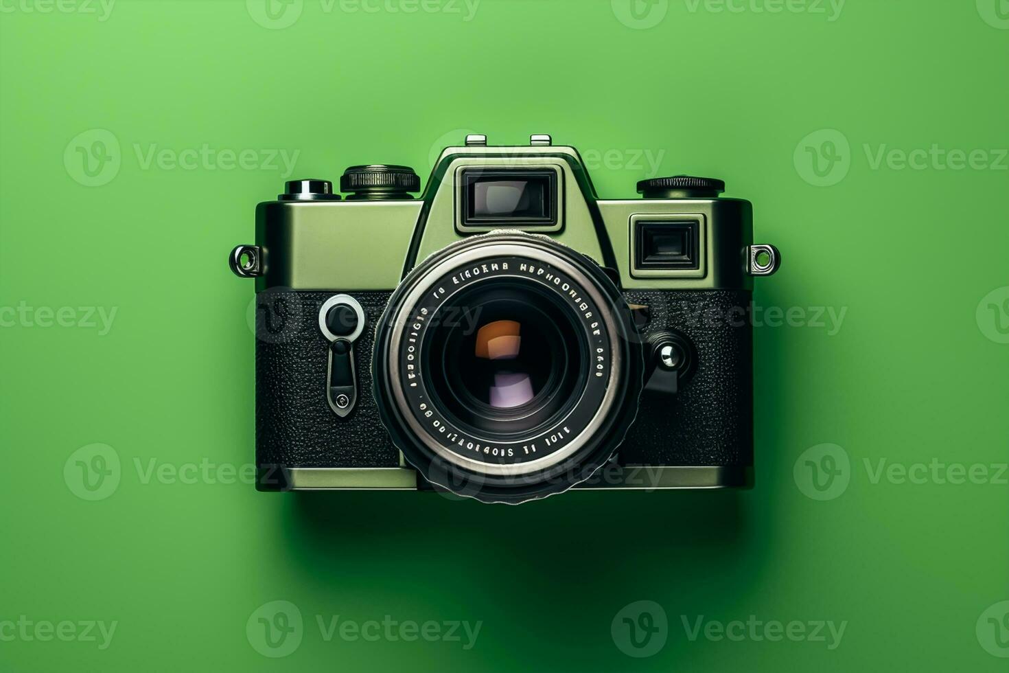 Retro camera on a green background, top view, flat lay photo