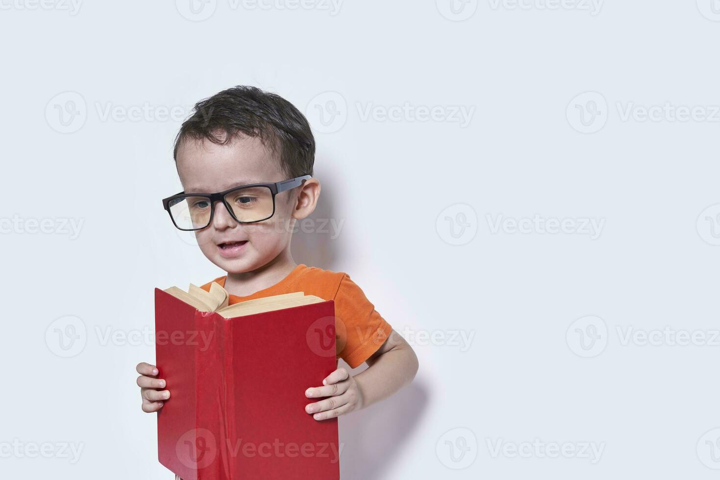 A cute little boy wearing big eyeglasses photo