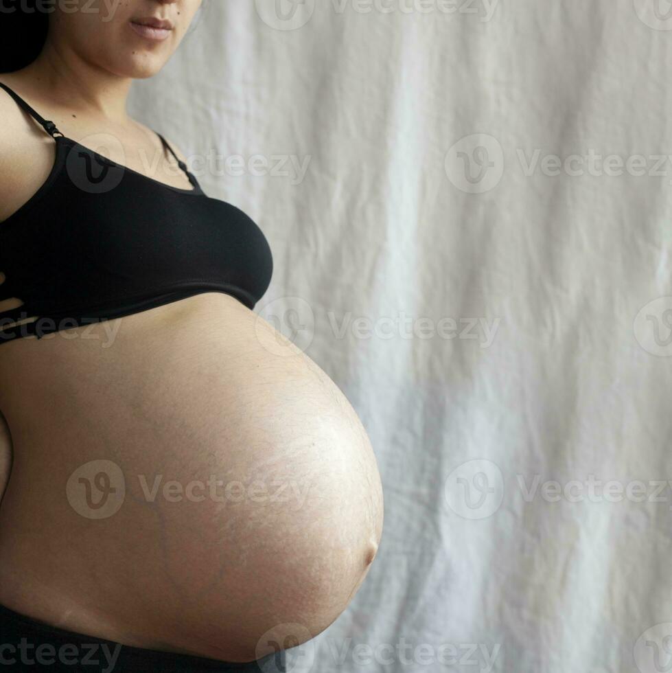 Pregnant woman. 9th Month of Pregnancy. Copy space photo