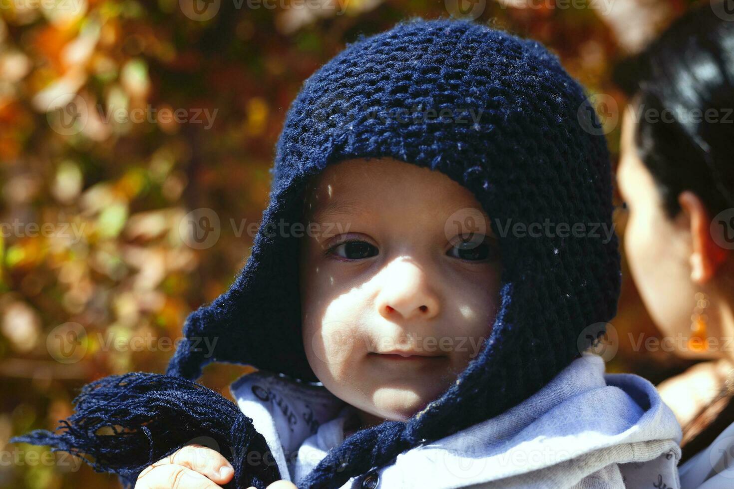 Mother holding cute sweet son photo