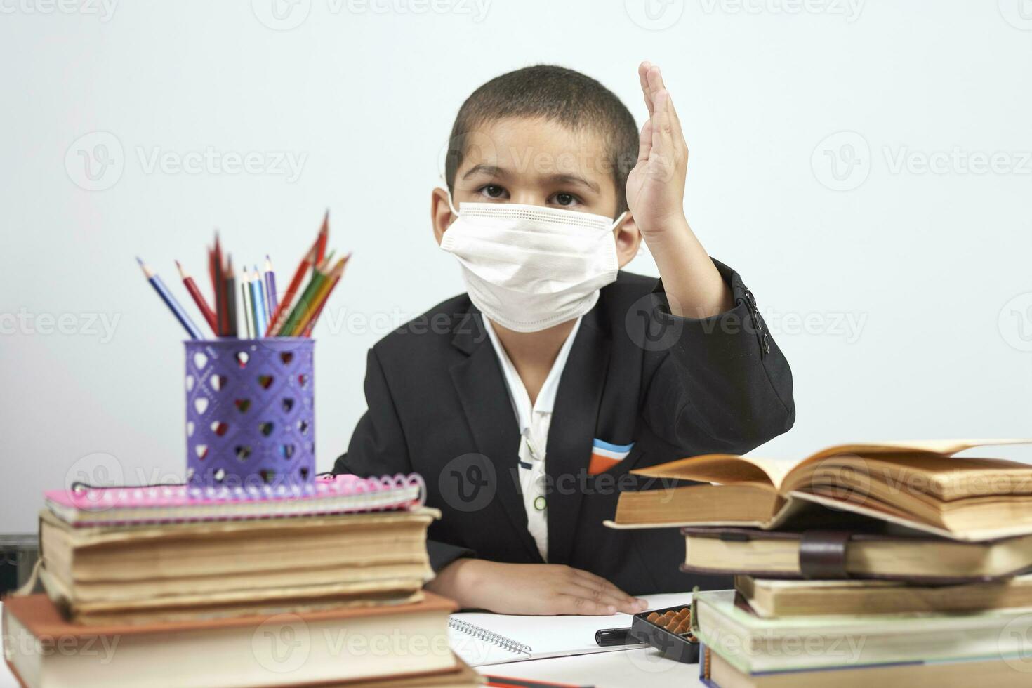 Back to school after covid-19 pandemic. Schoolboy during a school activity photo