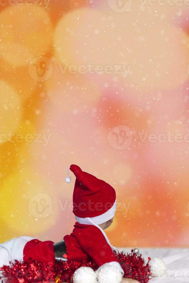 Little Santa. 6-9 months old baby boy in Santa Claus costume. Merry christmas photo
