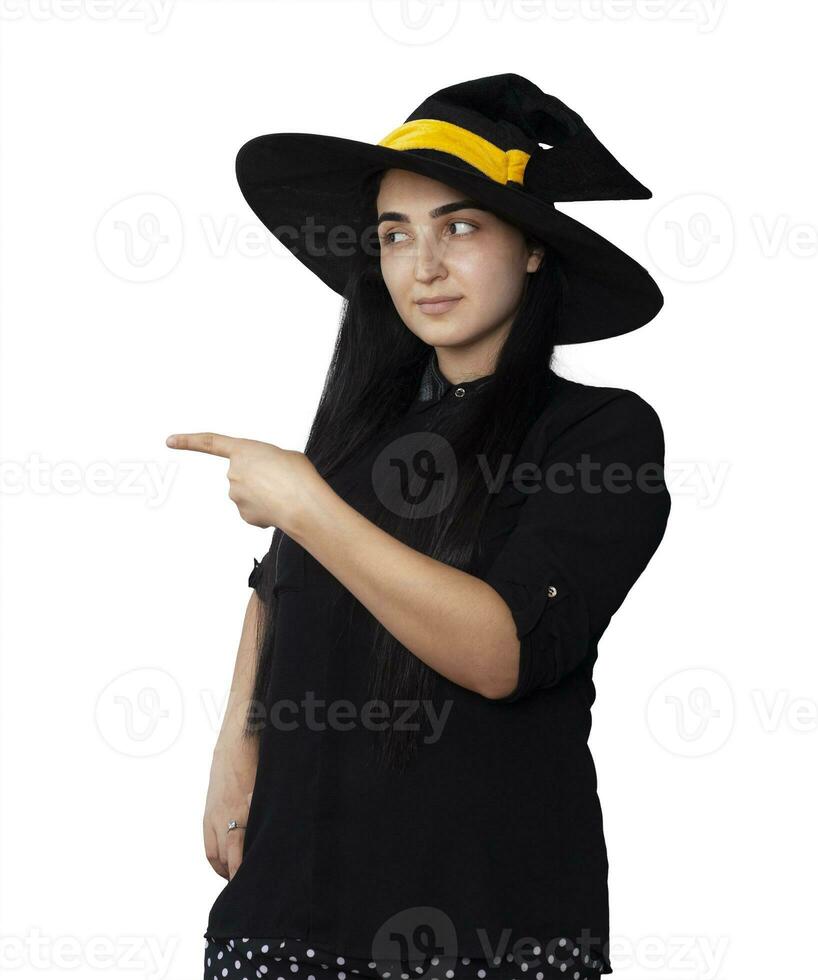 Portrait of young woman in witch costume isolated on white background. Halloween theme on white photo