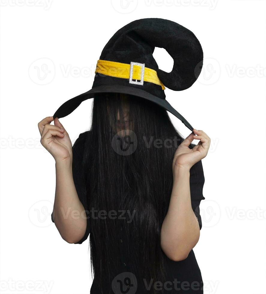 Portrait of young woman in witch costume isolated on white background. Halloween theme on white photo