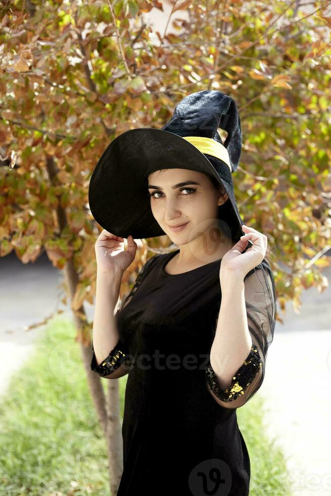 Woman in a witch costume photo