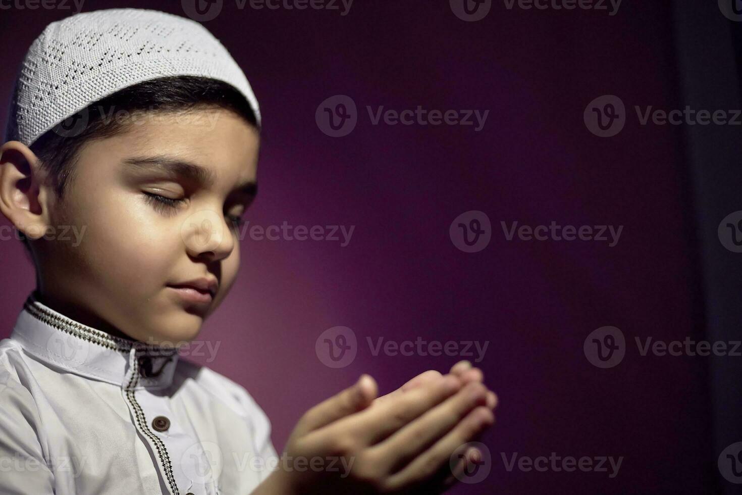 Praying muslim boy photo