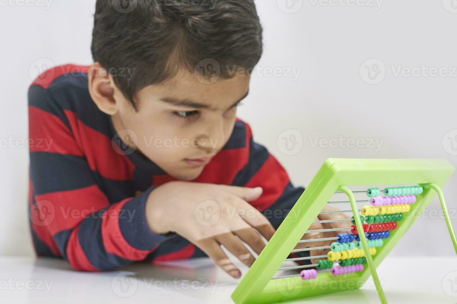 A schoolboy do mental math photo