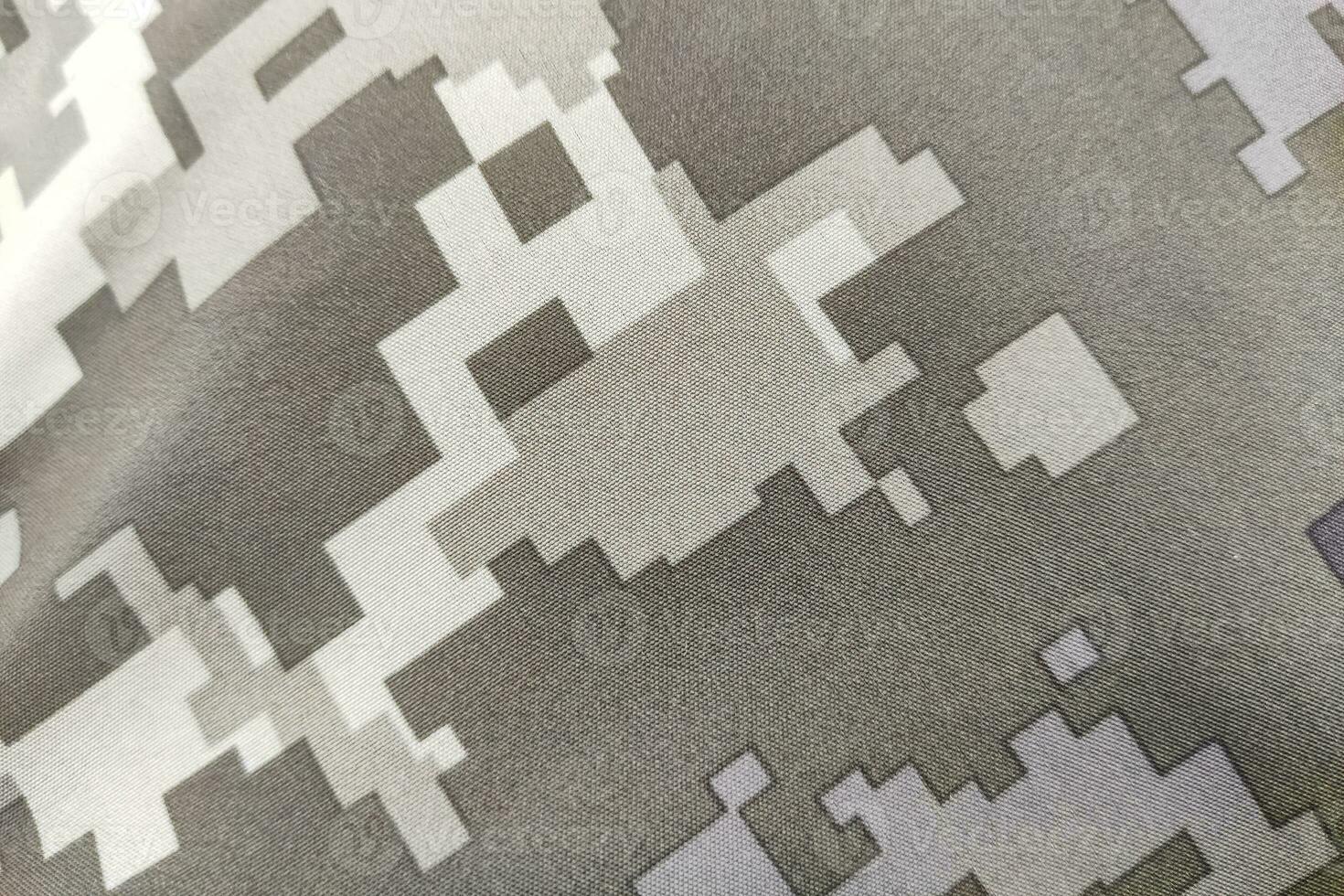 Texture close-up pixel camouflage military uniform of the Armed Forces photo