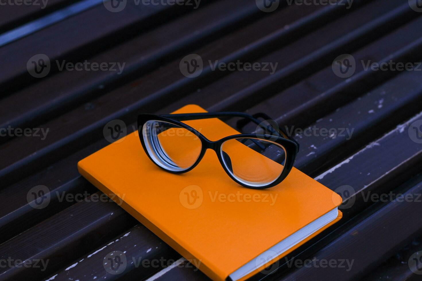 Eyeglasses on notepad, study concept, time management photo