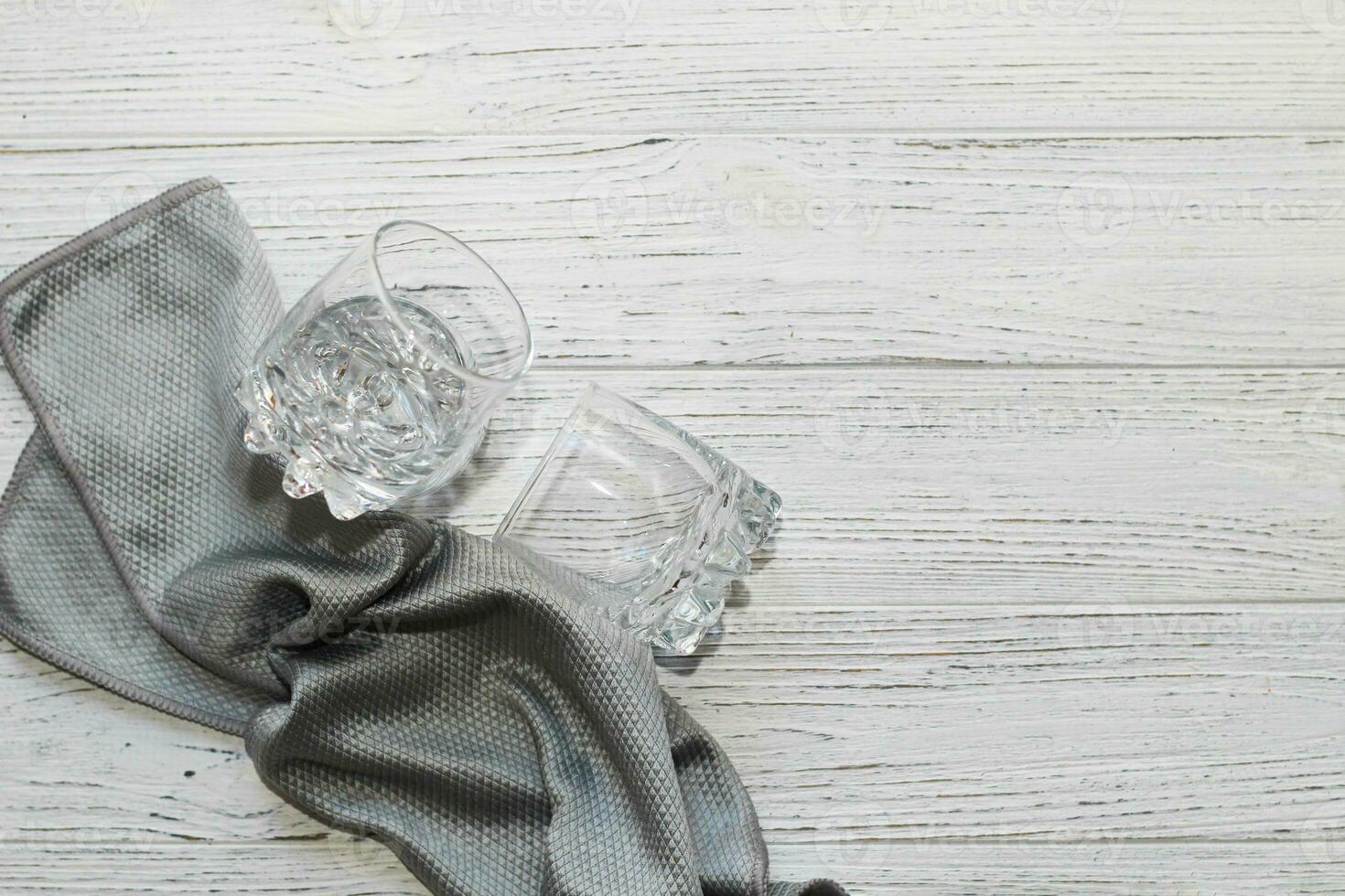 a rag with a special texture for cleaning glass glasses and dishes for home use. photo