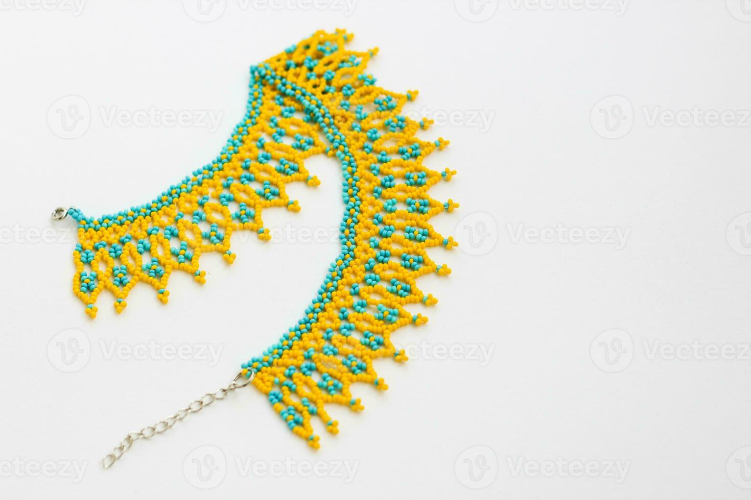 Beaded neck ornament, traditional ethnic silyanka, in yellow-blue colors photo