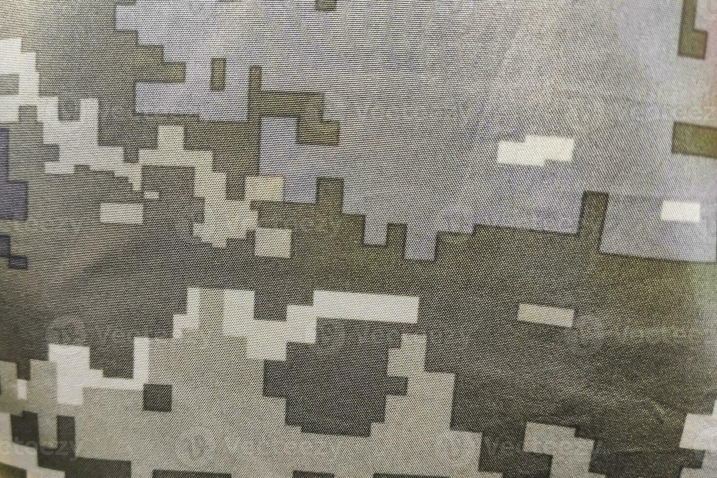 Texture close-up pixel camouflage military uniform of the Armed Forces photo
