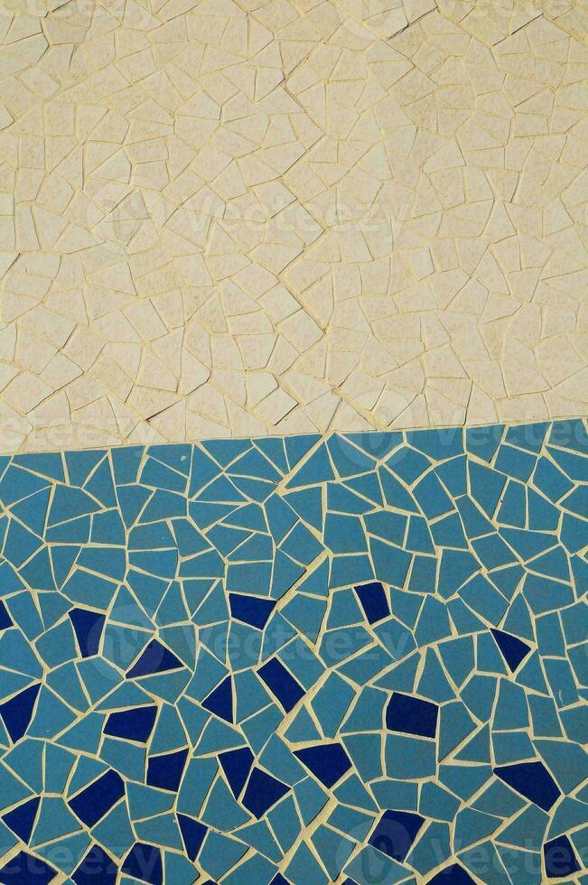 a mosaic tile pattern on the floor of a pool photo