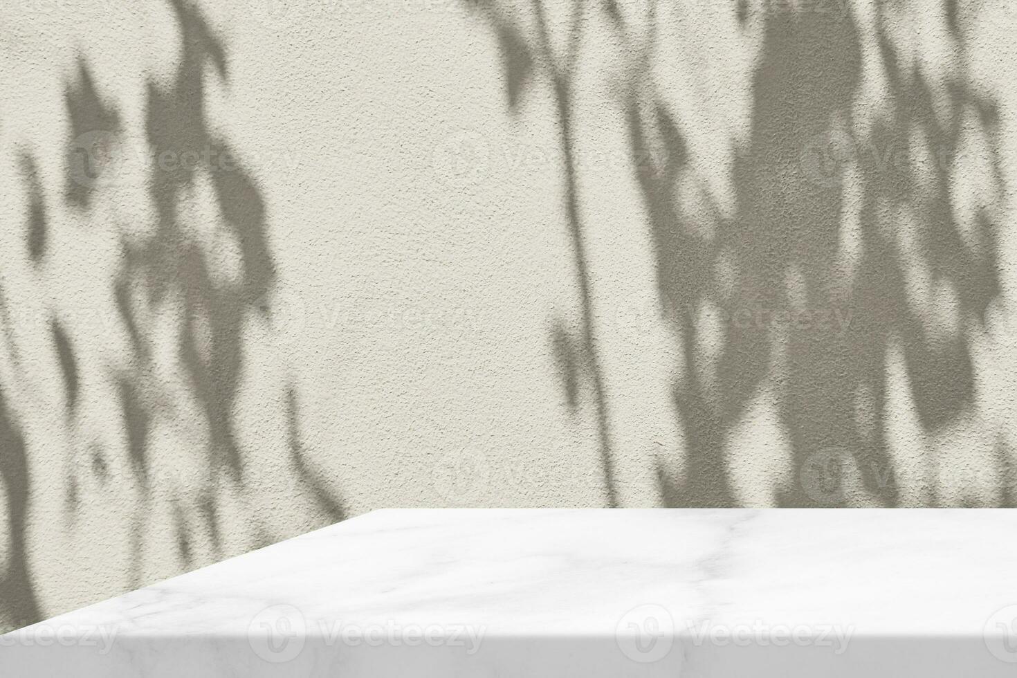 Minimal White Marble Table Corner with Tree Shadow on the Beige Concrete Wall Background, Suitable for Product Presentation Backdrop, Display, and Mock up. photo
