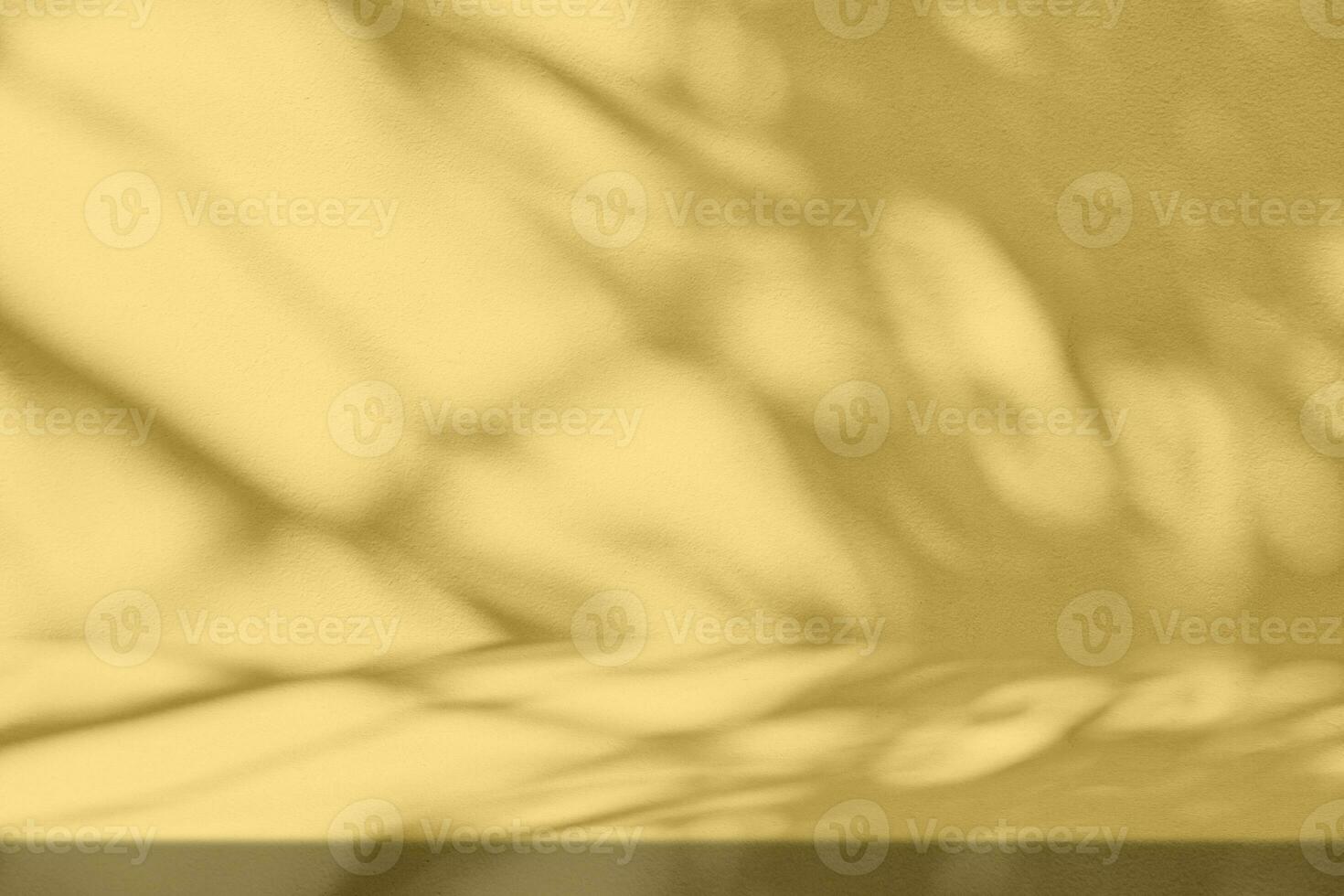 Gold Stucco Table with Nature Shadow on Concrete Wall Texture Background, Suitable for Cosmetic Product Presentation Backdrop, Display, and Mock up. photo