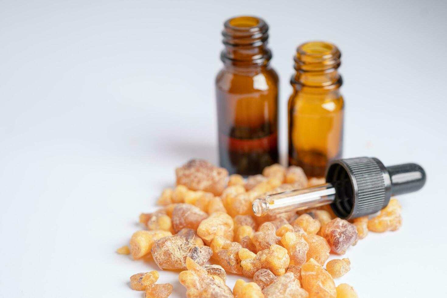 Frankincense or olibanum aromatic resin isolated on white background used in incense and perfumes. photo