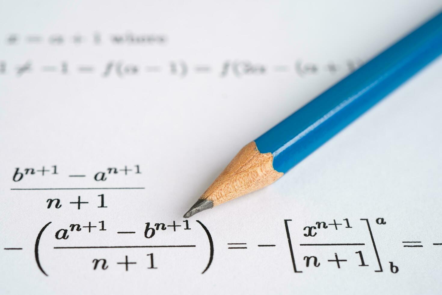 Pencil on mathematic formula exercise test paper in education school. photo