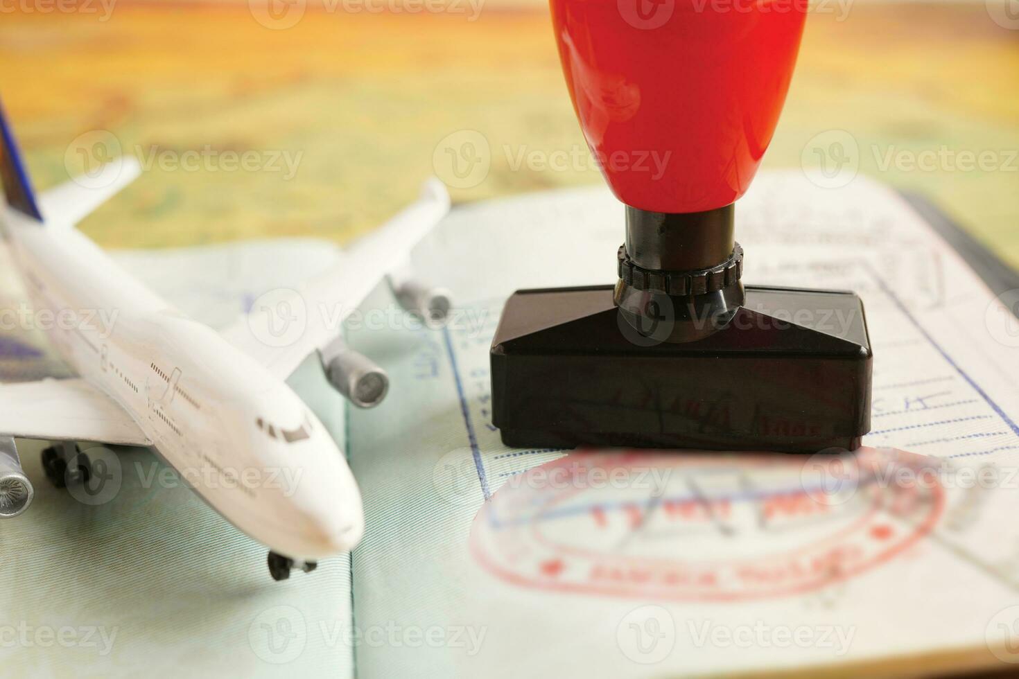 Visa and passport with approved stamp on document for tourism to immigration at airport in country. photo