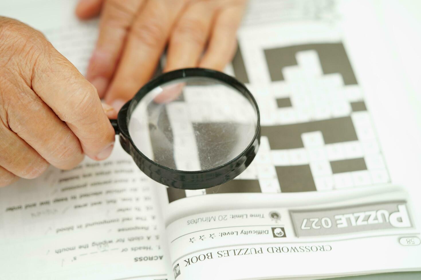 Bangkok, Thailand - May 15, 2022 elderly woman playing sudoku puzzle game for treatment dementia prevention and Alzheimer disease. photo