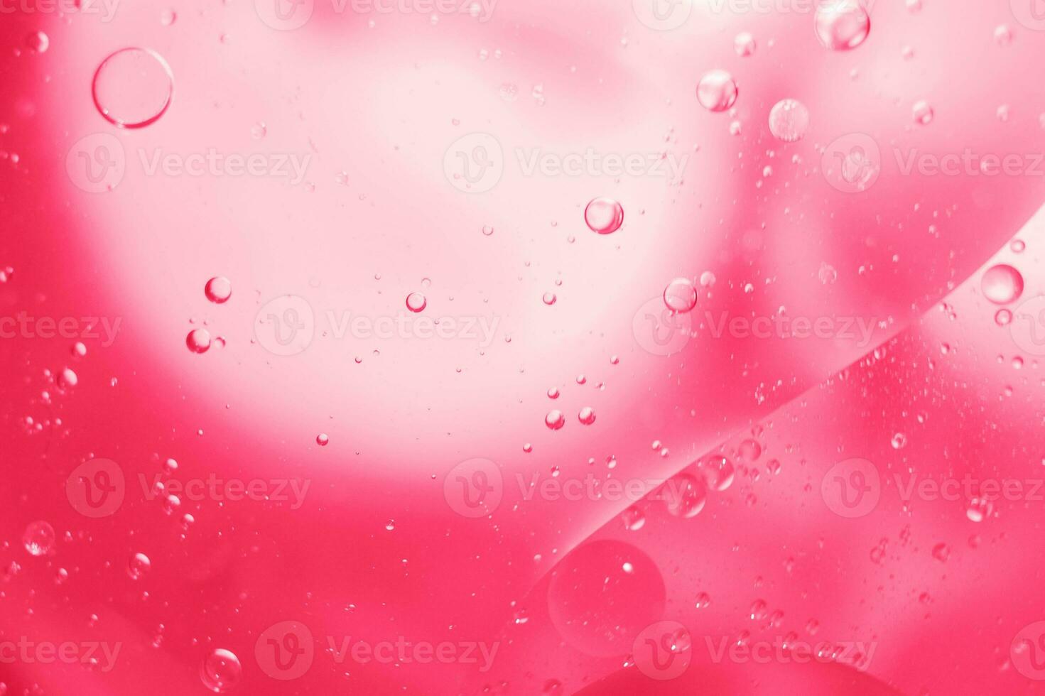 Pink Oil bubbles close up. circles water macro. abstract shiny viva magenta background photo
