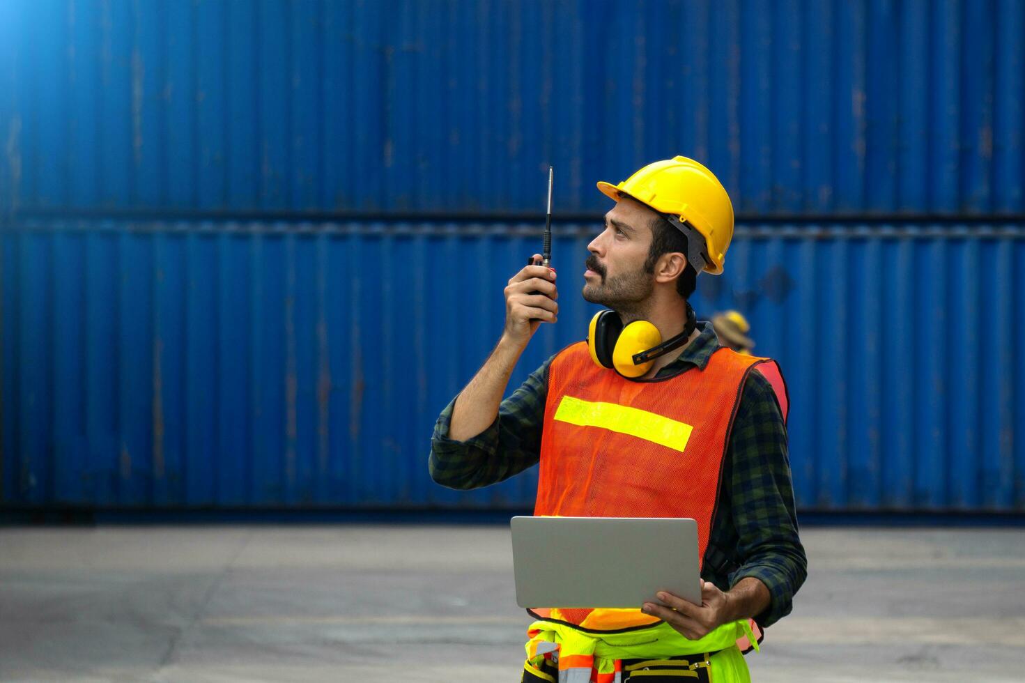 industrial worker is controlling container loading in import-export business. photo