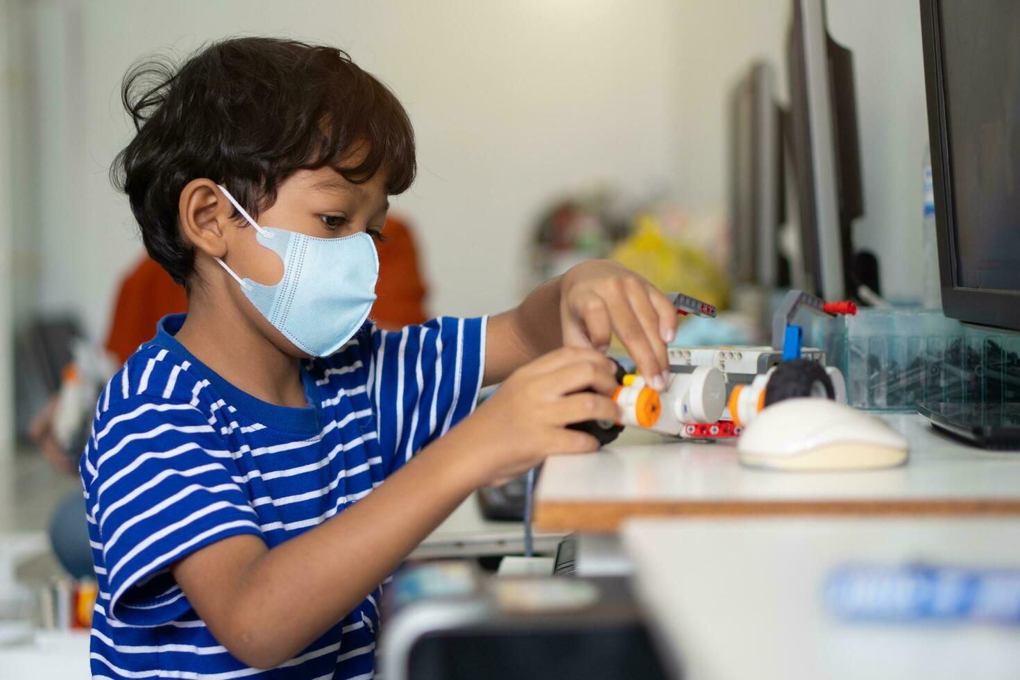 Boy wear face masks to prevent the Coronavirus 2019 COVID-19 in schools. photo