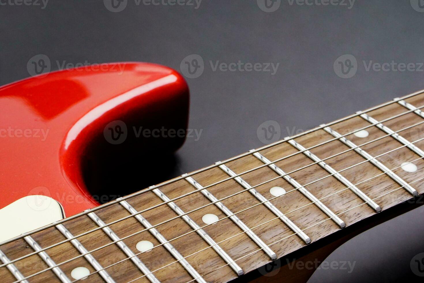 Electric guitar body isolated on black background. Entertainment and music concept. photo