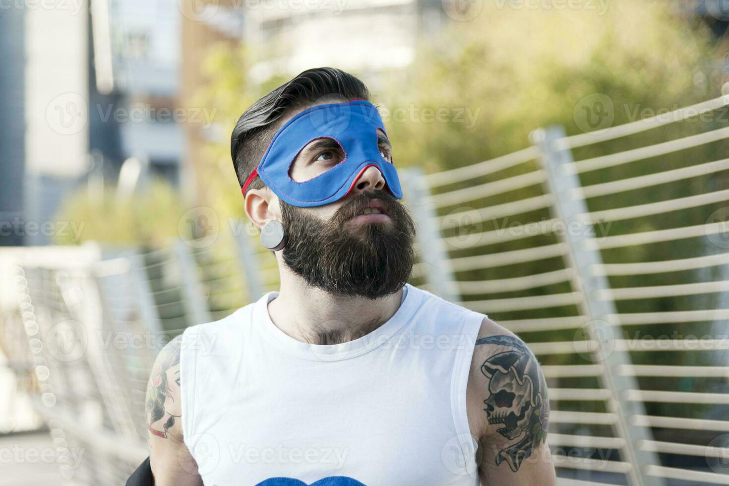 young hipster superhero fights evil photo