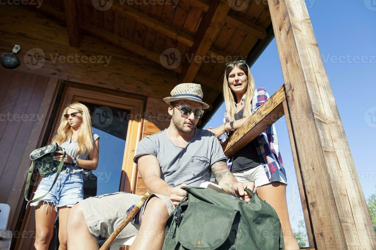 group of young hikers preparing excursion photo