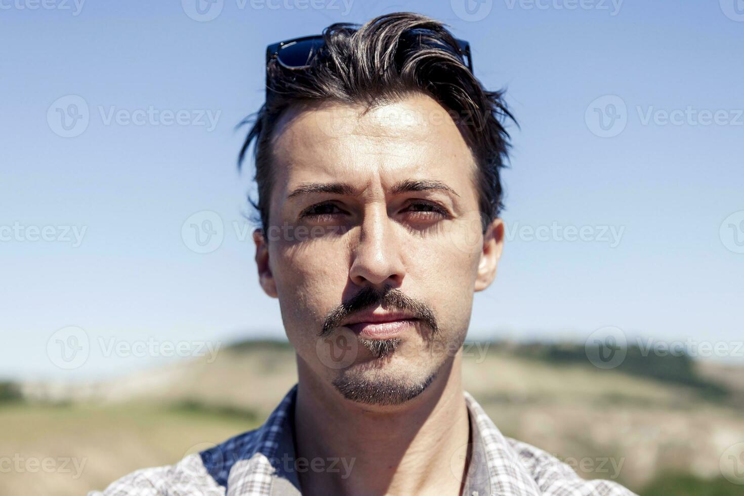 portrait of handsome young adult outdoor on vacation photo