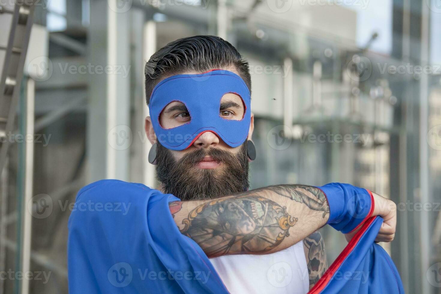 young hipster superhero is protecting the ccenter of town photo