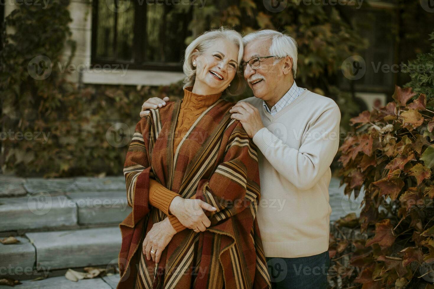 Senior couple embracing in autumn park photo