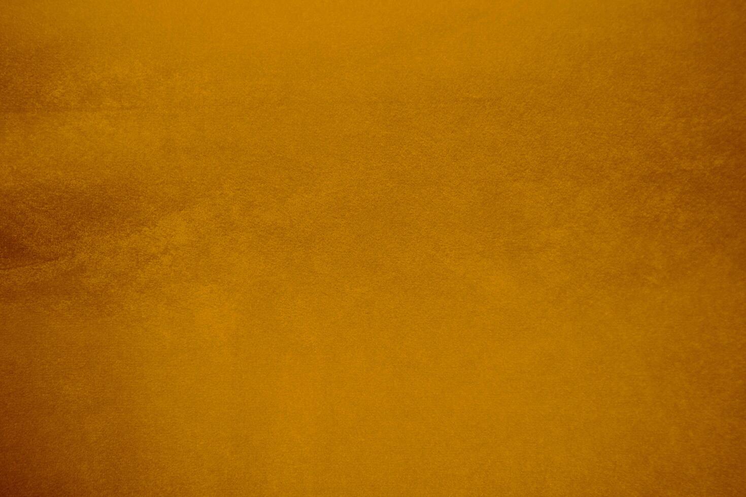 Orange velvet fabric texture used as background. Orange color panne fabric background of soft and smooth textile material. crushed velvet .luxury Orange tone for silk.. photo