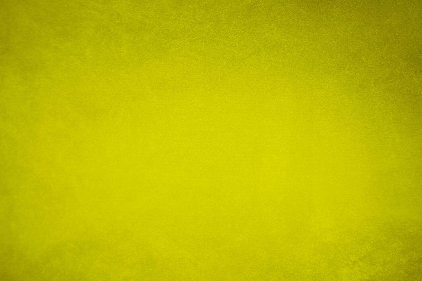 golden velvet fabric texture used as background. blond color panne fabric background of soft and smooth textile material. crushed velvet .luxury yellow tone for silk.. photo