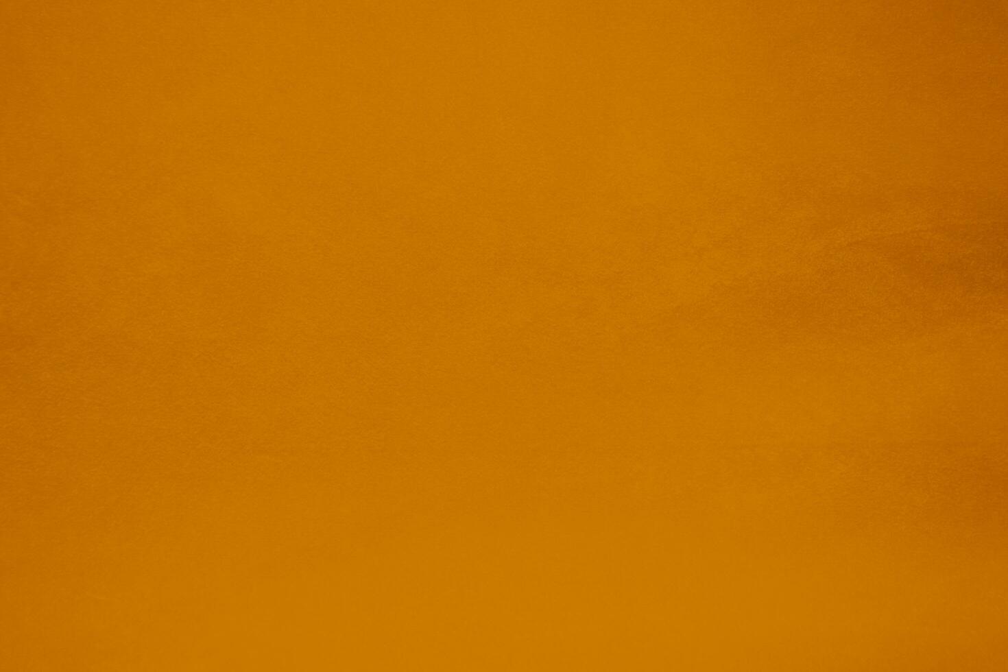 Orange velvet fabric texture used as background. Orange color panne fabric background of soft and smooth textile material. crushed velvet .luxury Orange tone for silk.. photo