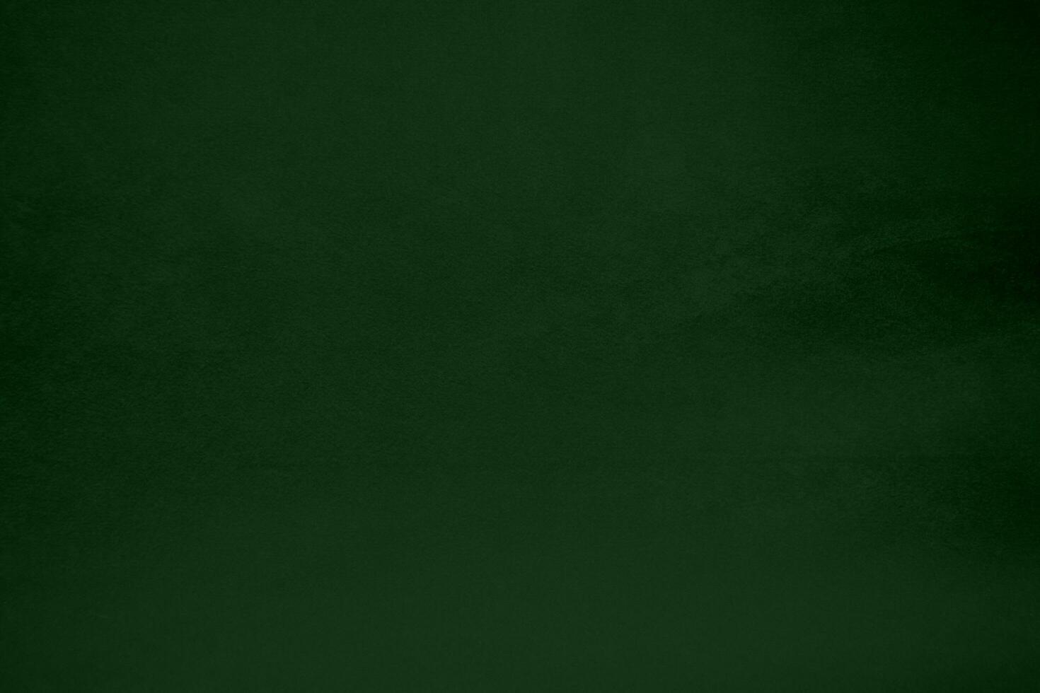 Light green velvet fabric texture gradient used as background. Emerald color panne fabric background of soft and smooth textile material. crushed velvet .luxury emerald tone for silk. photo