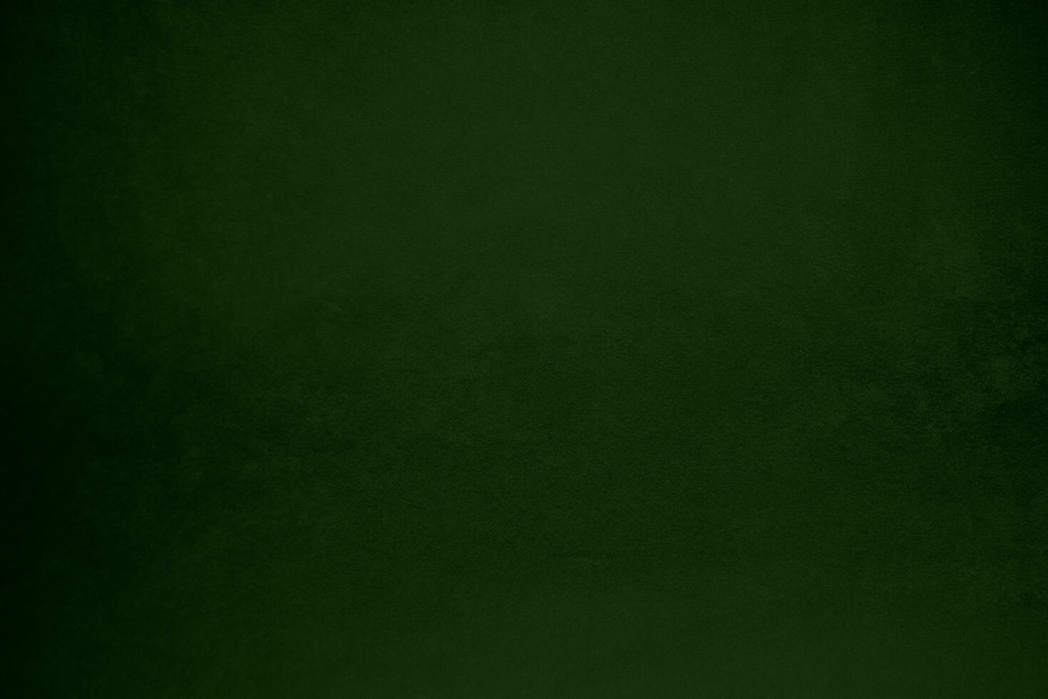Light green velvet fabric texture gradient used as background. Emerald color panne fabric background of soft and smooth textile material. crushed velvet .luxury emerald tone for silk. photo