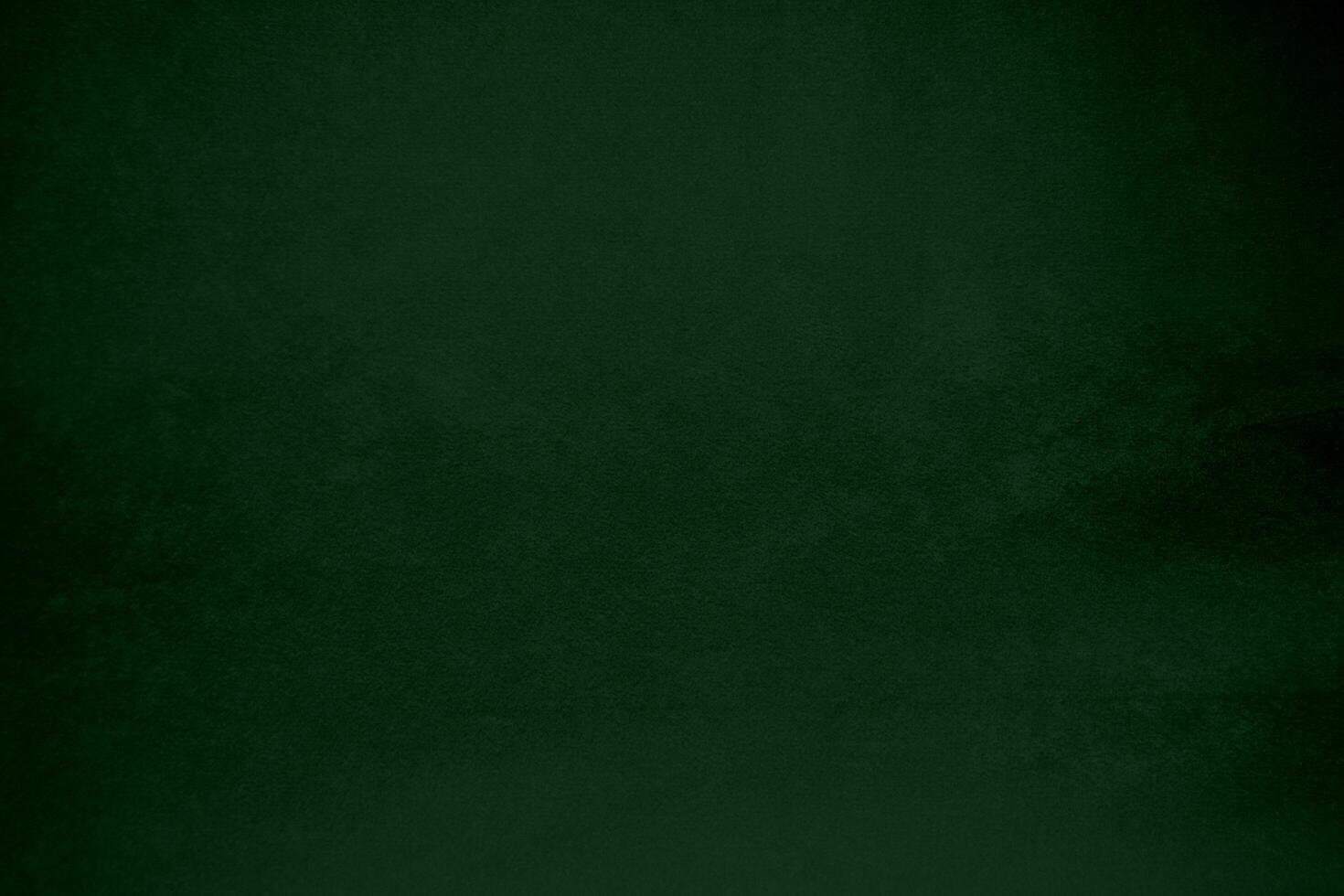 Light green velvet fabric texture gradient used as background. Emerald color panne fabric background of soft and smooth textile material. crushed velvet .luxury emerald tone for silk. photo