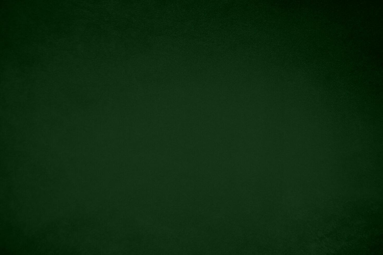 Light green velvet fabric texture gradient used as background. Emerald color panne fabric background of soft and smooth textile material. crushed velvet .luxury emerald tone for silk. photo