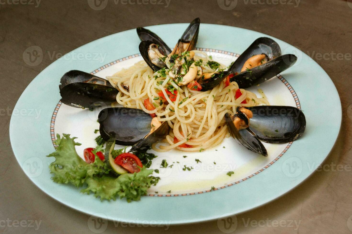 Italian cuisine. First dishes. Pasta with mussels. photo