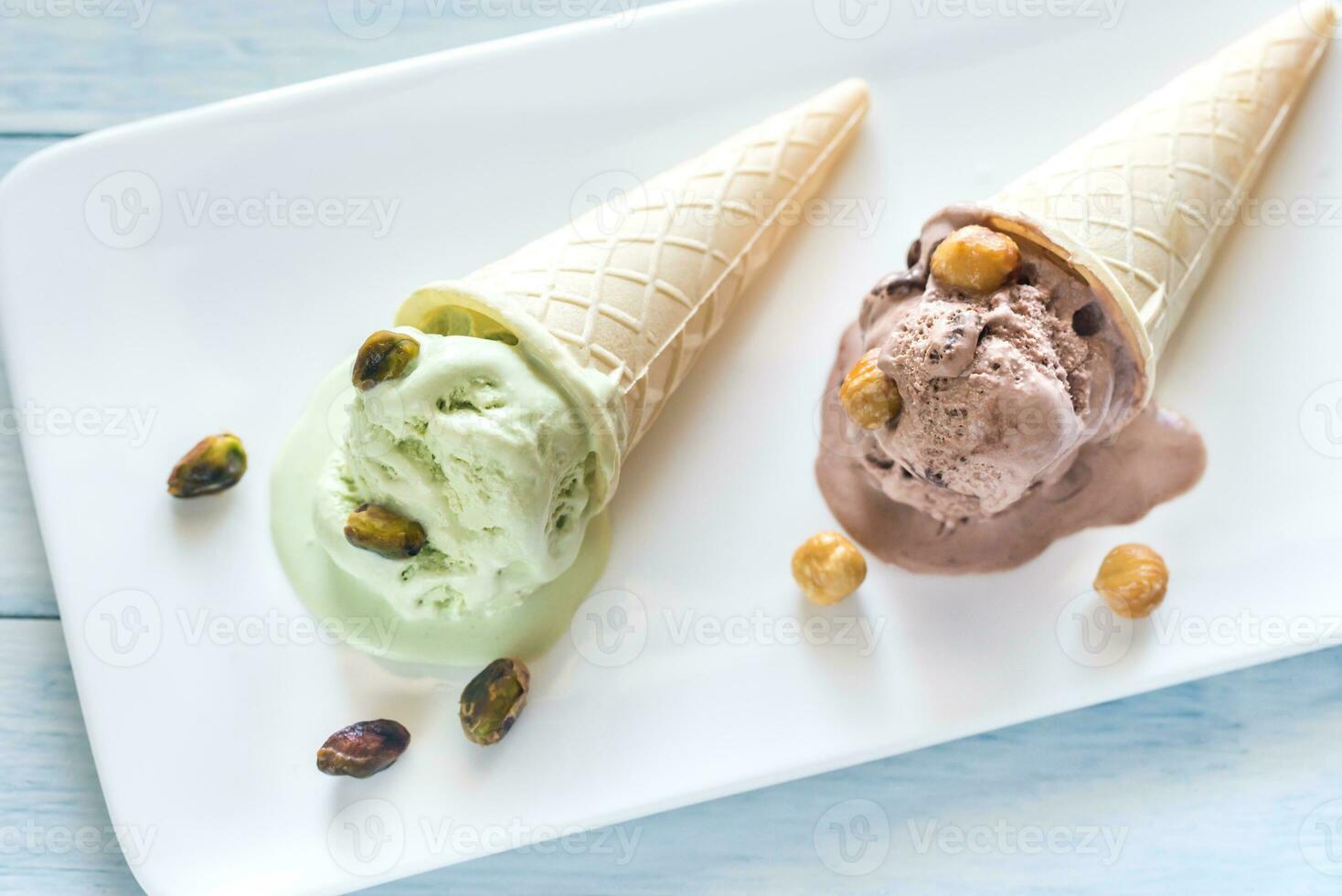 Two cones of nut-flavored ice cream photo