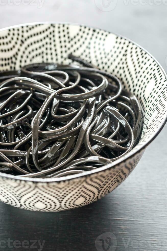 Bowl of black pasta photo