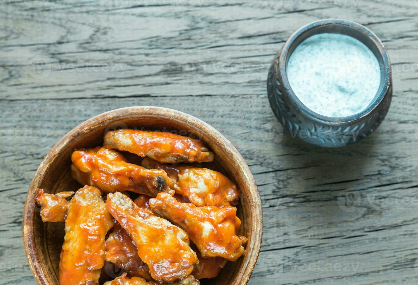 Bowl of buffalo chicken wings photo